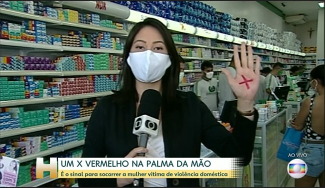 Um X vermelho na palma da mão: sinal de pedido socorro para vítima de violência